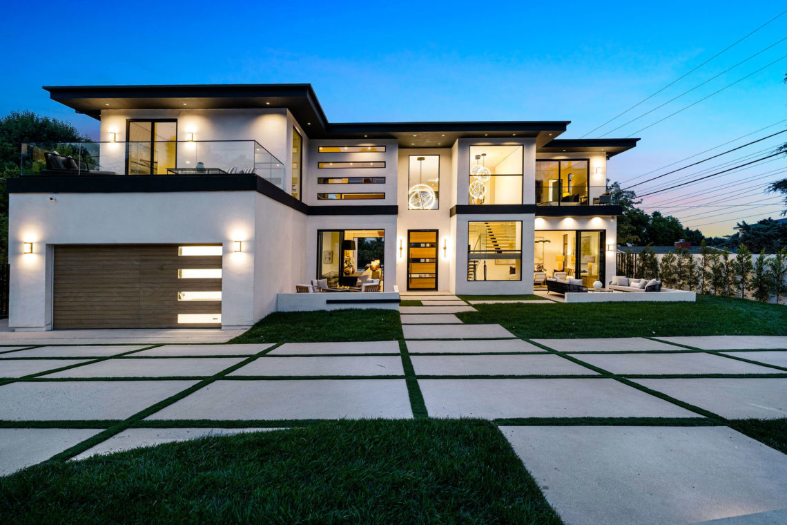 Contemporary architectural facade with clean aluminum windows and folding doors