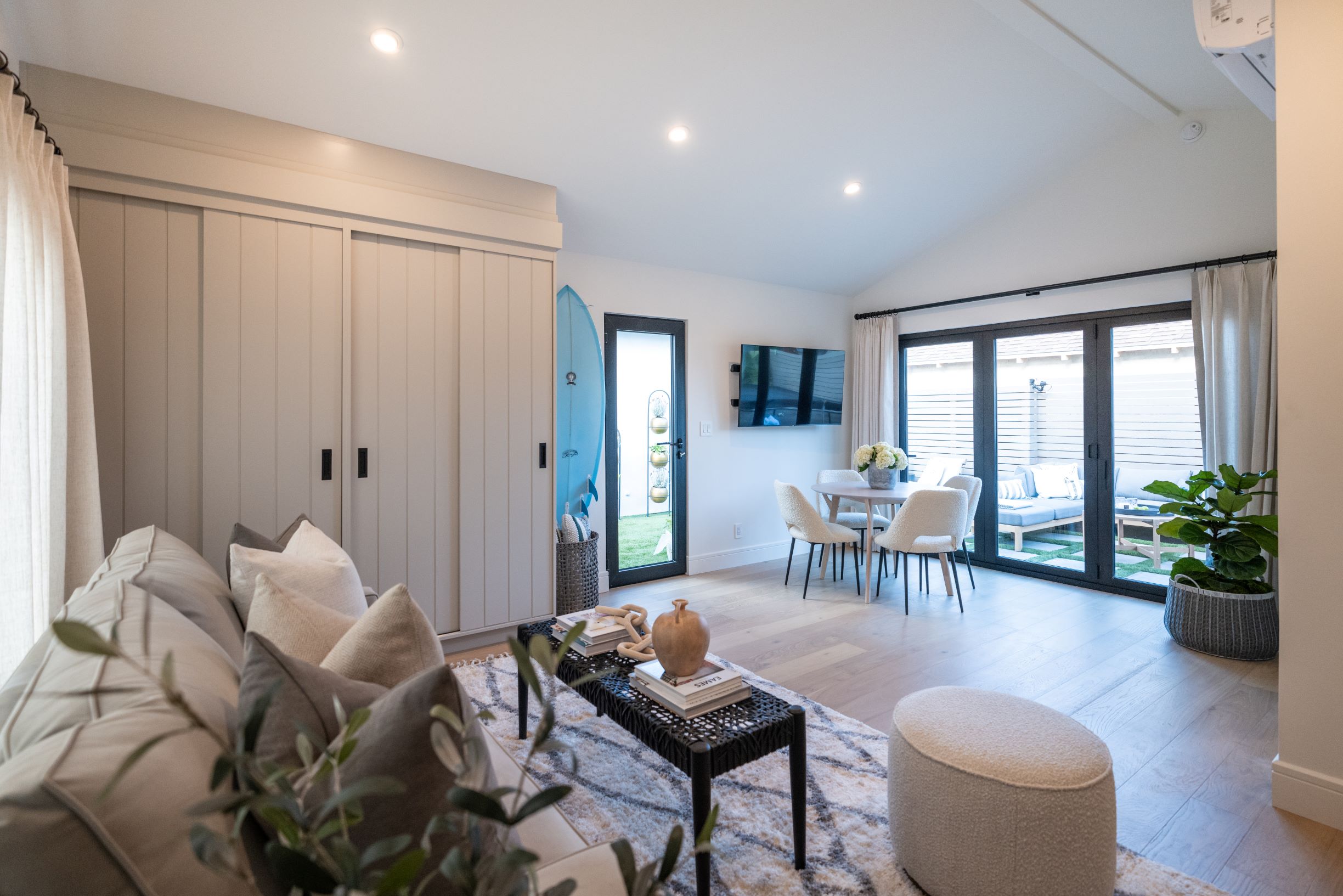 Interor Photo of the Living Room, which showcases windows with sunlight shining in the glass created by All Weather Architectural Aluminum.