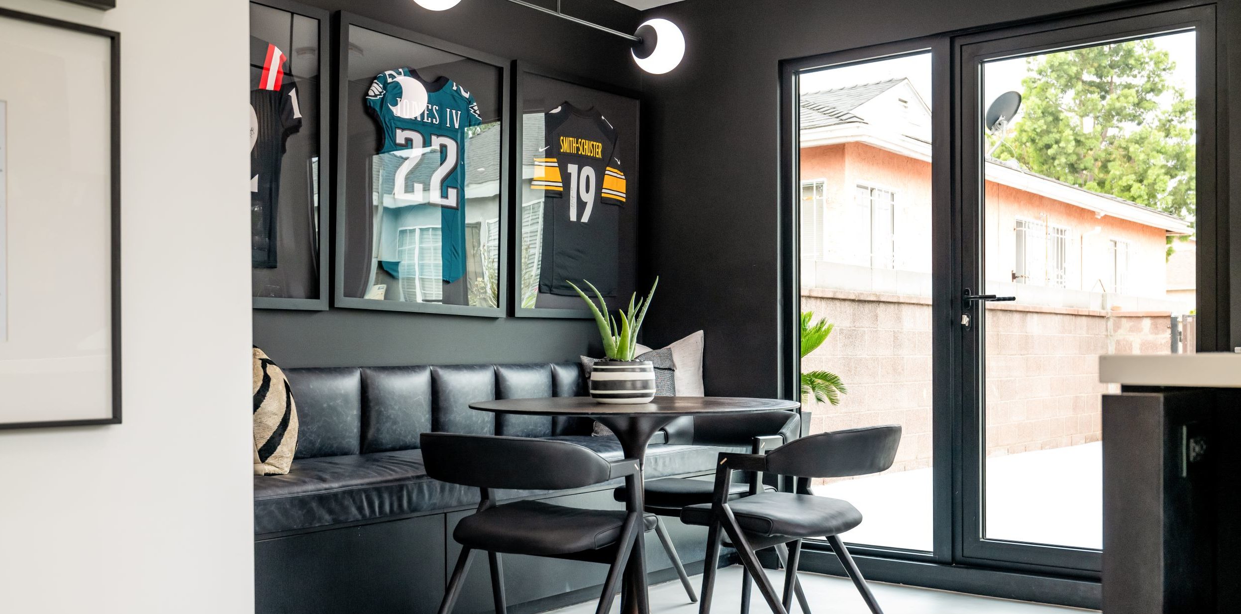 Snoop Dogg Celebrity IOU project showcasing open thermal folding doors made by All Weather Architectural Aluminum.